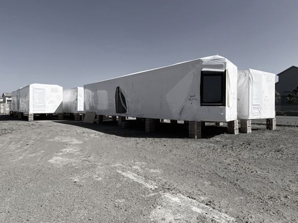 Finished modular units, two studios per box plus the corridor, waiting on Mare Island for the concrete podium to be completed.